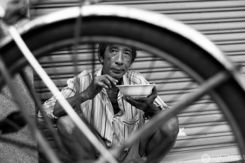 Cyclo driver eating a soup