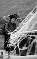 Ha Giang - Hmong woman spinning hemp