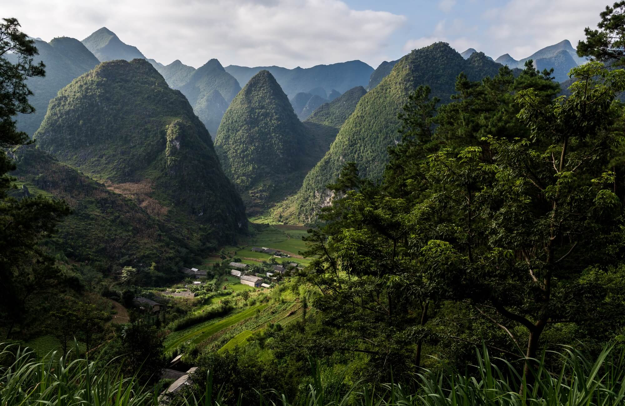 North Vietnam panoramic view of Dong Van village hidden in the valley North Vietnam panoramic view of Dong Van village hidden in the valley